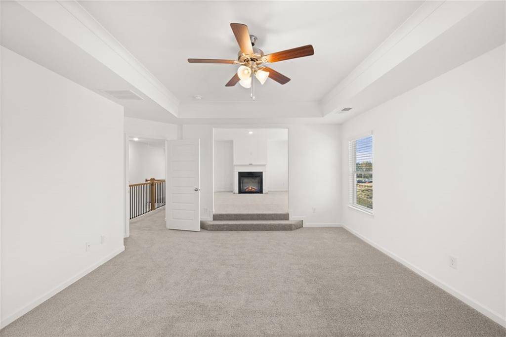 1787 Goodwin Drive Hampton, GA 30228 - Photo 33 of 55 a view of a livingroom with a ceiling fan and window