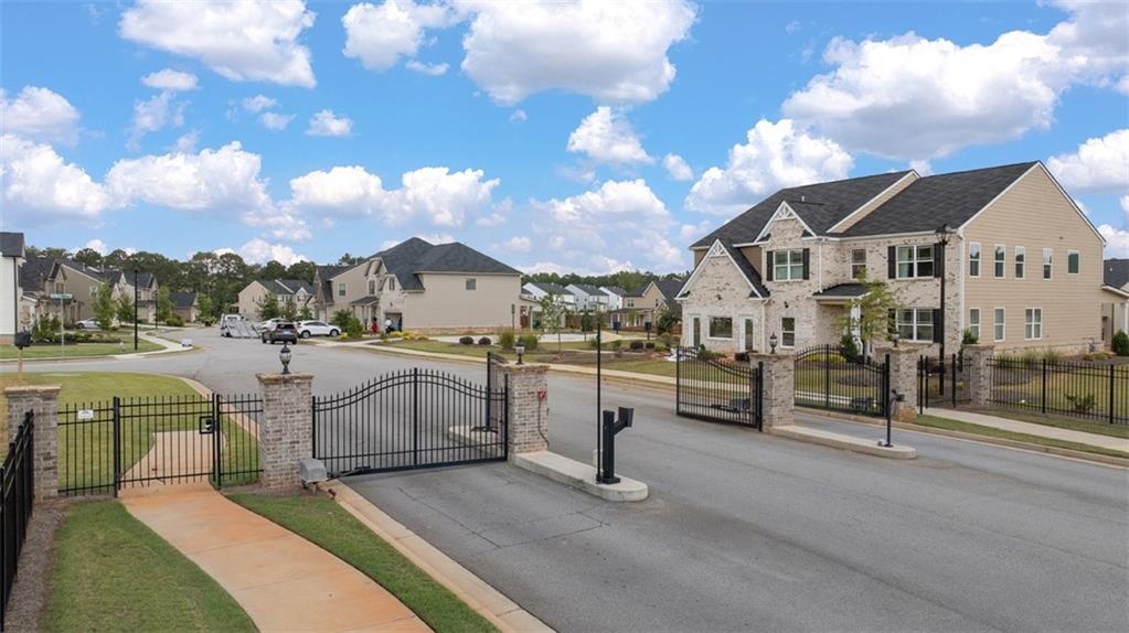 1787 Goodwin Drive Hampton, GA 30228 - Photo 43 of 55 a view of multiple houses with a yard