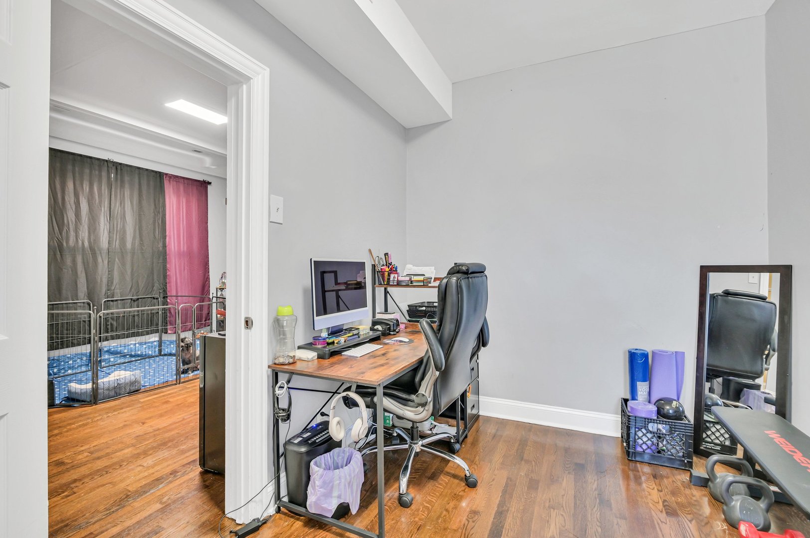 7208 South Eberhart Avenue Chicago, IL 60619 - Photo 16 of 20 a view of a workspace with furniture and wooden floor