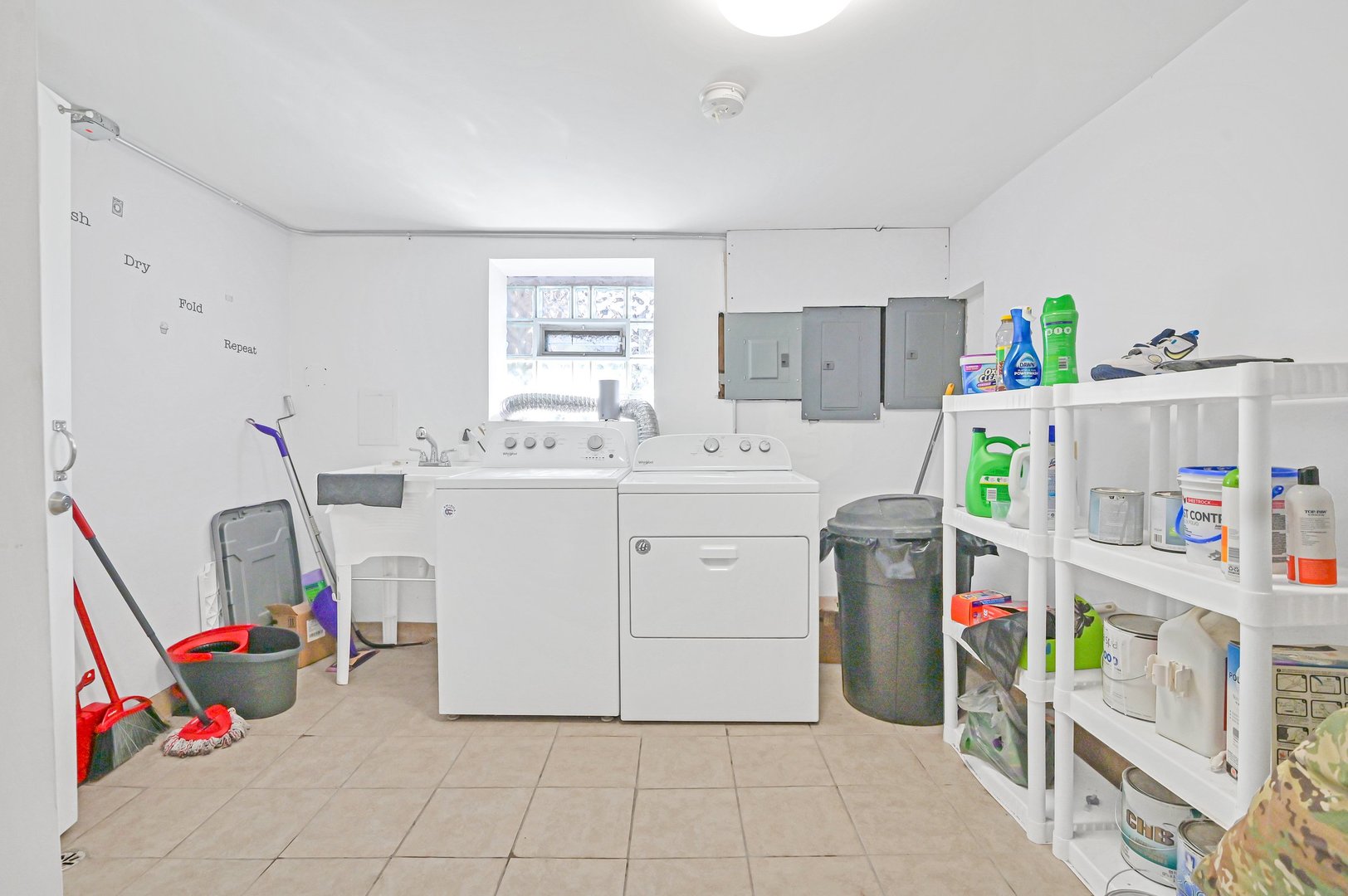 7208 South Eberhart Avenue Chicago, IL 60619 - Photo 18 of 20 a utility room with cabinets dryer and washer