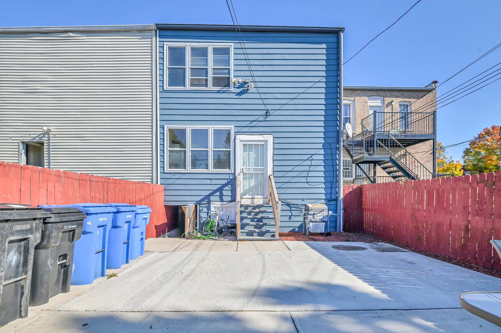 7208 South Eberhart Avenue Chicago, IL 60619 - Photo 20 of 20 a backyard of a house with seating space