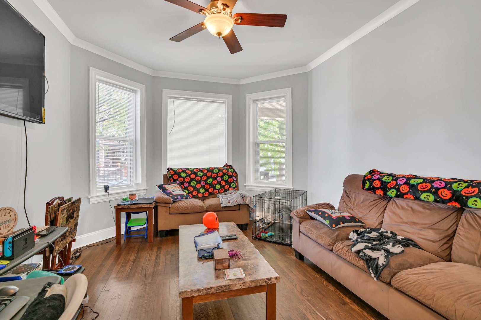 7208 South Eberhart Avenue Chicago, IL 60619 - Photo 4 of 20 a bedroom with furniture and a wooden floor