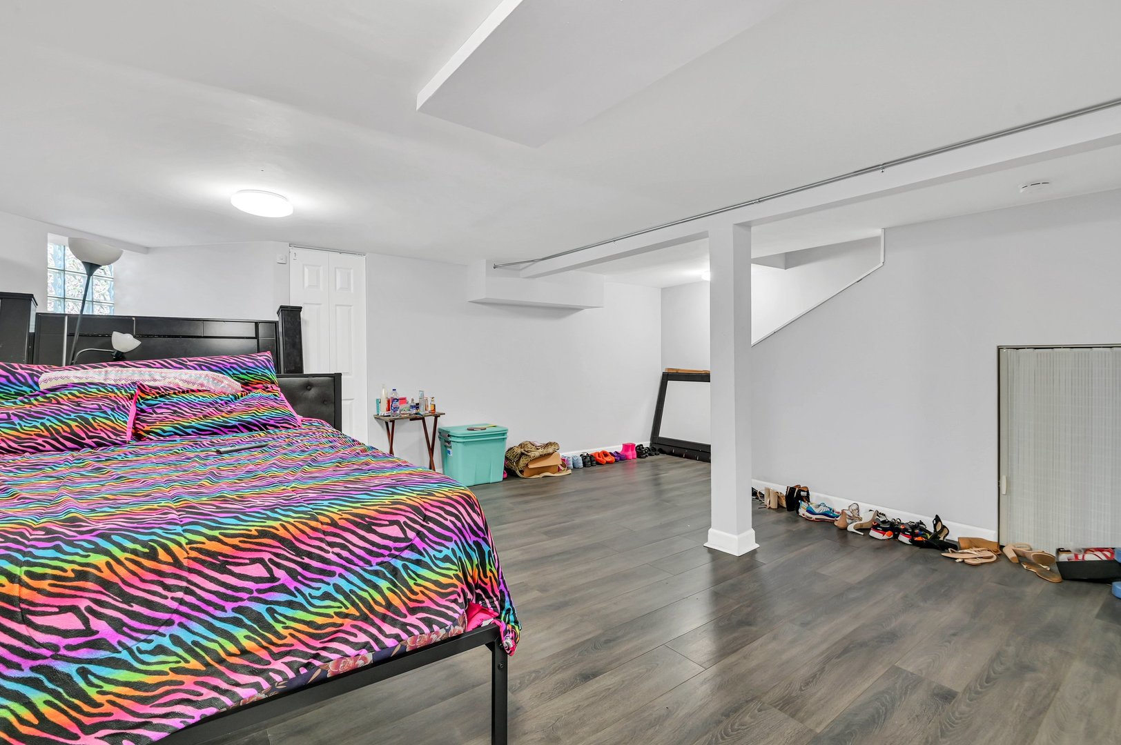 7208 South Eberhart Avenue Chicago, IL 60619 - Photo 8 of 20 a bedroom with bed and window