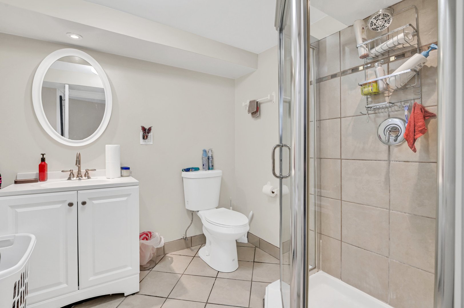 7208 South Eberhart Avenue Chicago, IL 60619 - Photo 9 of 20 a bathroom with a toilet sink vanity and mirror