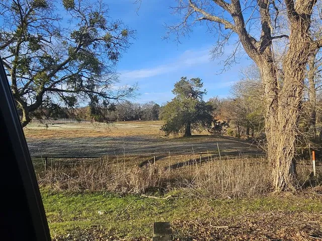 a view of a yard with an outdoor space