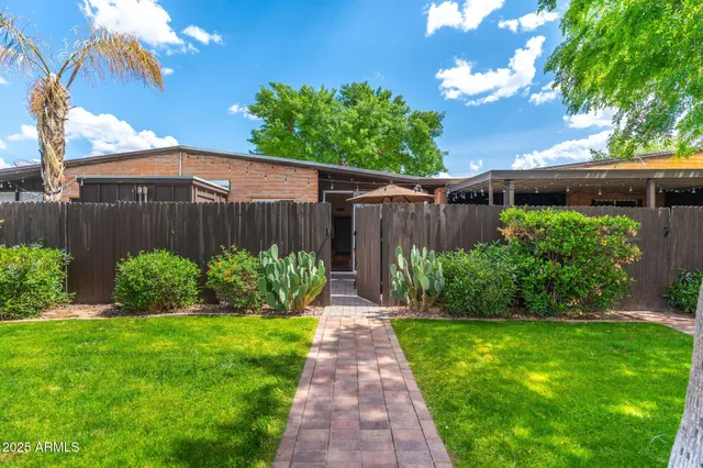 a view of pathway with a garden
