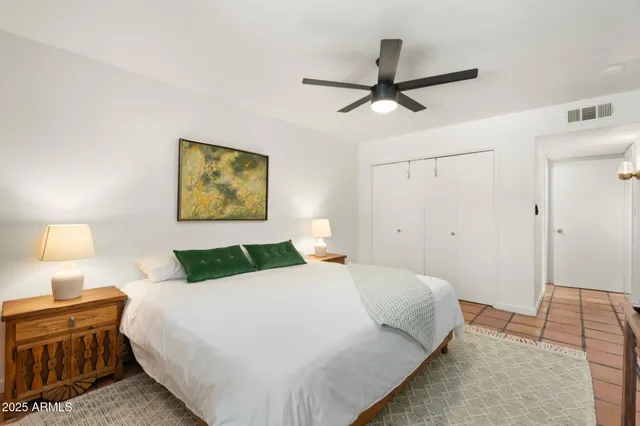 a bedroom with a bed and dresser