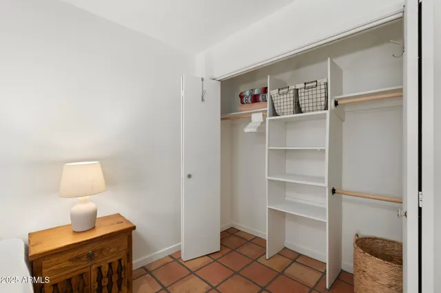 a view of an empty room and wooden floor