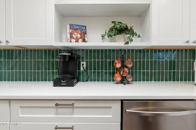 a view of a sink and cabinet with wooden floor