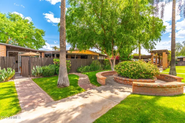 a view of a backyard with sitting area