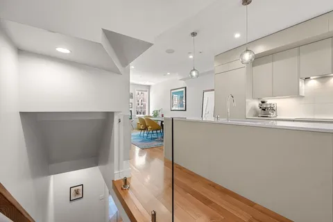 a kitchen with refrigerator and window