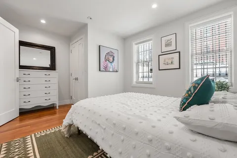 a bedroom with a bed and furniture