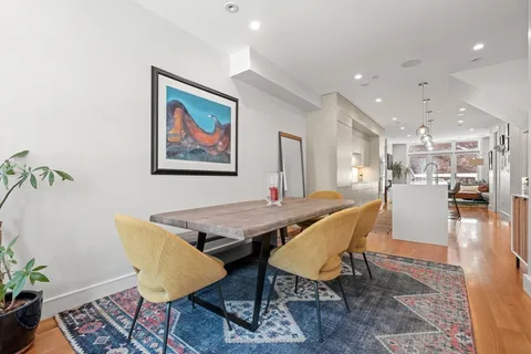 a dining room with a table and chairs