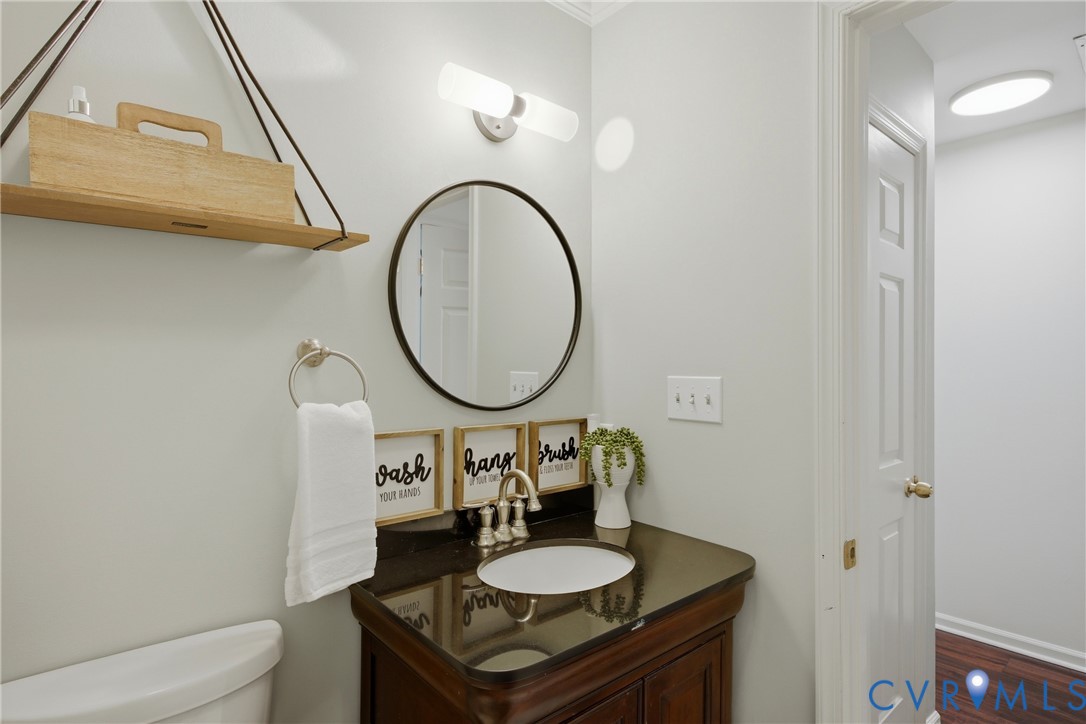 3724 Conduit Road Colonial Heights, VA 23834 - Photo 24 of 41 Bathroom vanity with a dark countertop and undermo