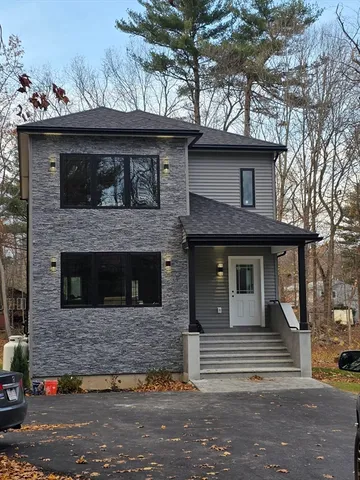 a view of a house with a yard