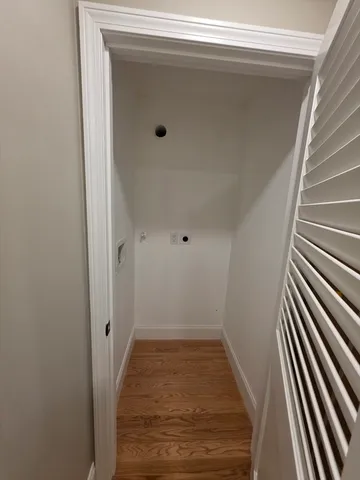 a view of a livingroom with wooden floor