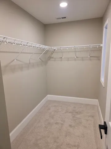 a view of a room with racks on the wall