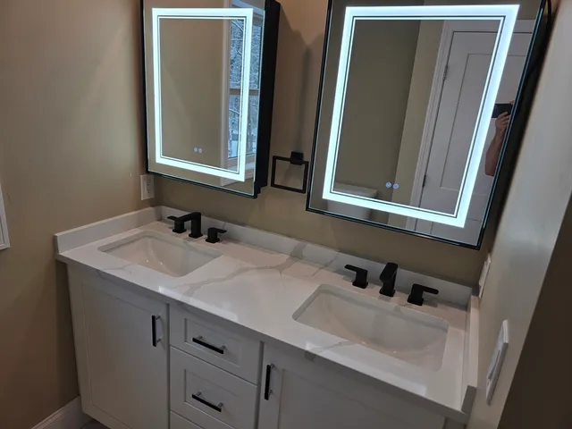 a bathroom with a sink and a mirror