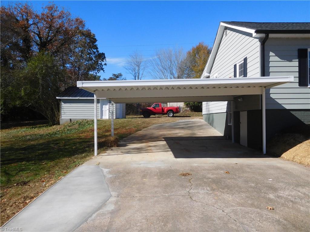 3830 Robinhood Road Winston-Salem, NC 27106 - Photo 26 of 30 ATTACHED CARPORT AT BACK OF HOME.