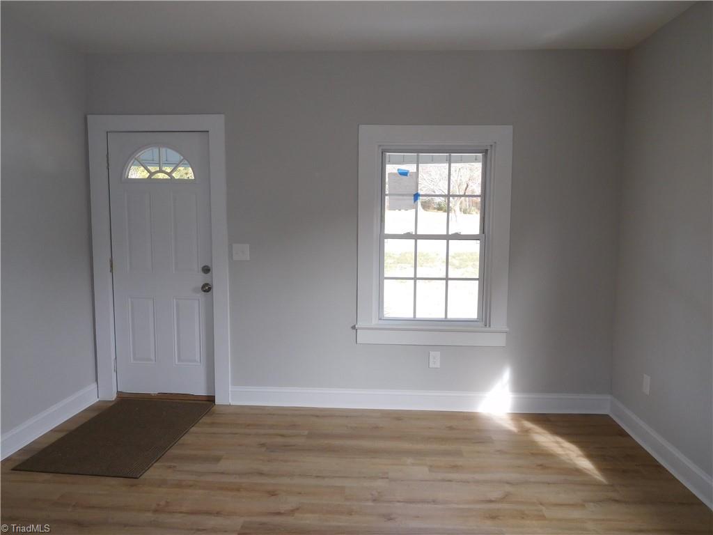 3830 Robinhood Road Winston-Salem, NC 27106 - Photo 4 of 30 LIVING ROOM. ALL NEW FLOORING THROUGHOUT HOME.