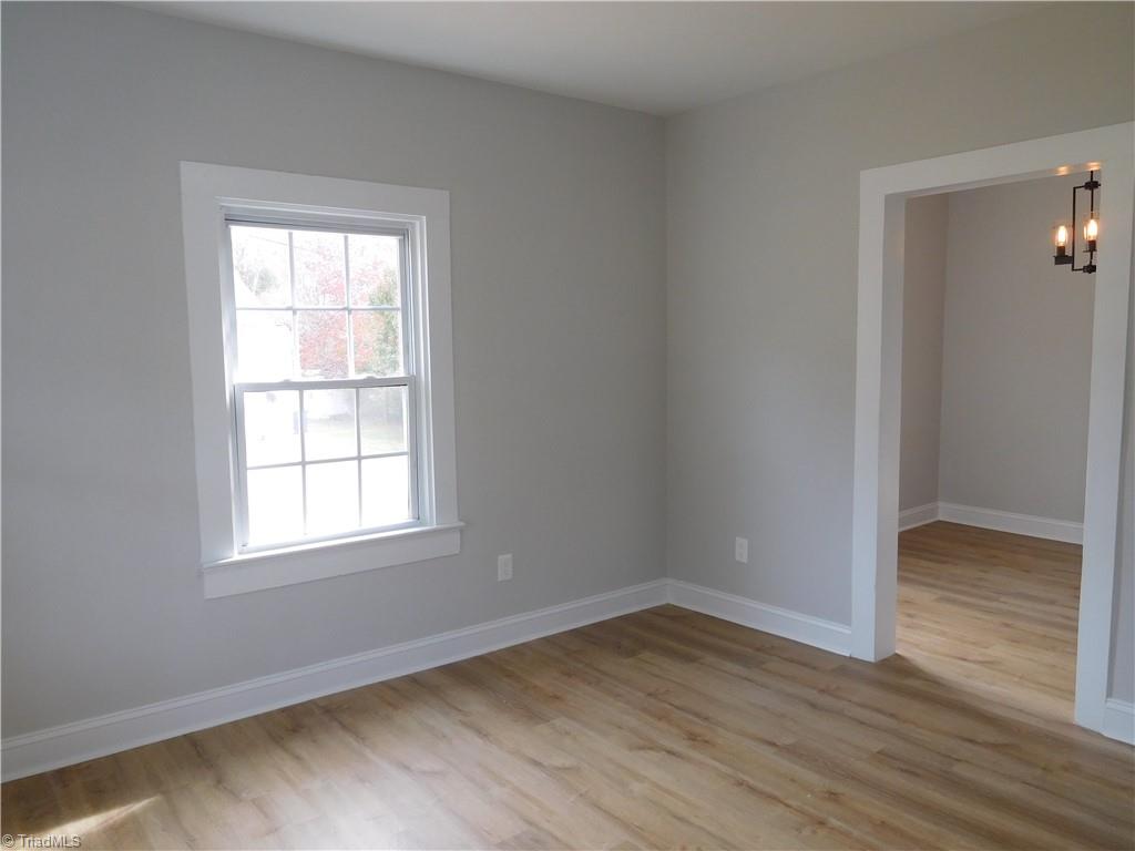 3830 Robinhood Road Winston-Salem, NC 27106 - Photo 6 of 30 LIVING ROOM. LOOKING BACK INTO DINING ROOM.