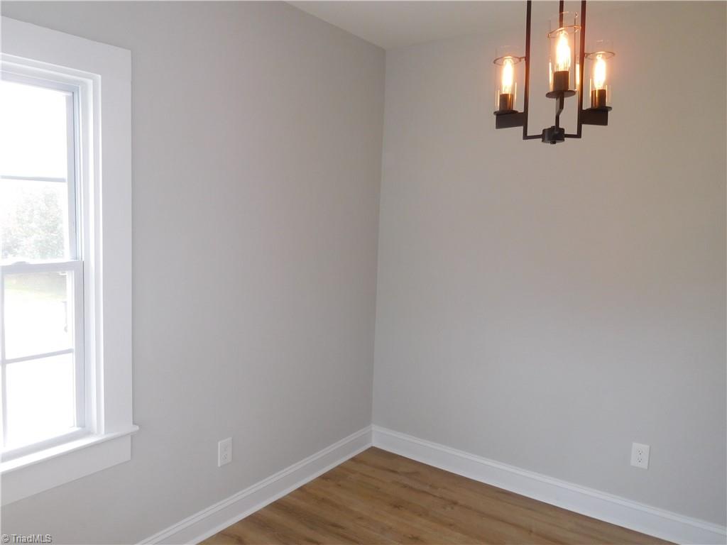 3830 Robinhood Road Winston-Salem, NC 27106 - Photo 7 of 30 DINING ROOM. FRESH INTERIOR PAINT. ALL NEW LIGHT FIXTURES.