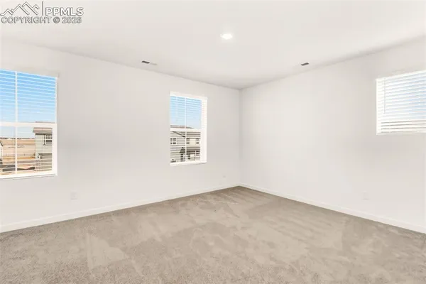an empty room with windows