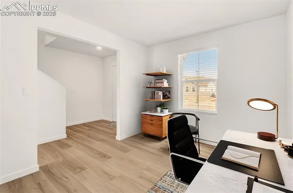 a living room with furniture and a window