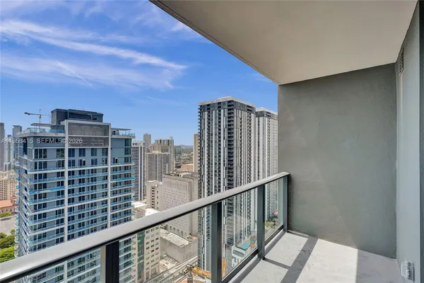 a view of balcony with a floor to ceiling window and wooden floor