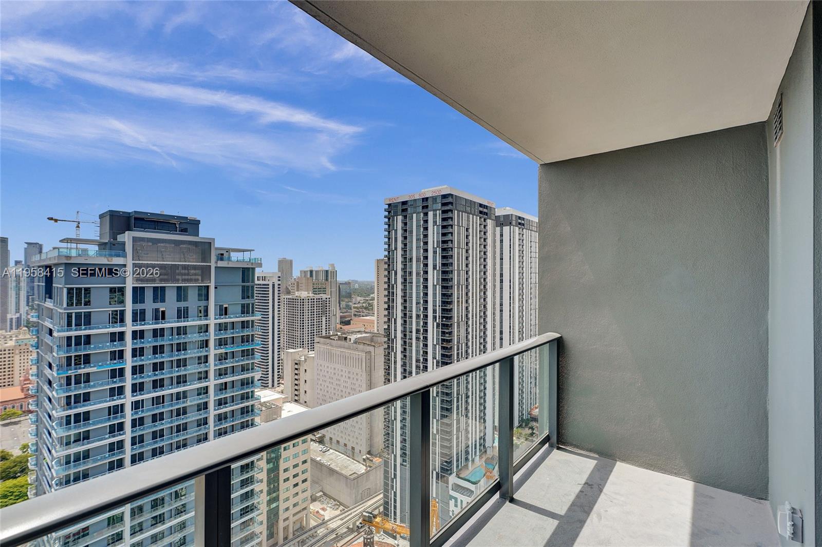 159 Northeast 6th Street, Unit 3405 Miami, FL 33132 - Photo 27 of 37 a view of balcony with a floor to ceiling window and wooden floor