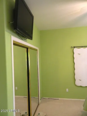 a view of a room with a flat screen tv