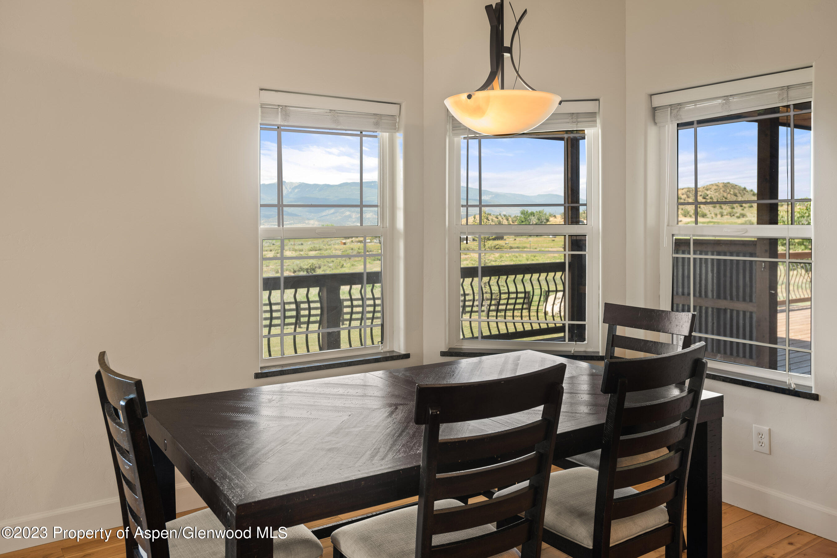 1148 County Road 237 Silt, CO 81652 - Photo 12 of 80 a view of a dining room with furniture and window