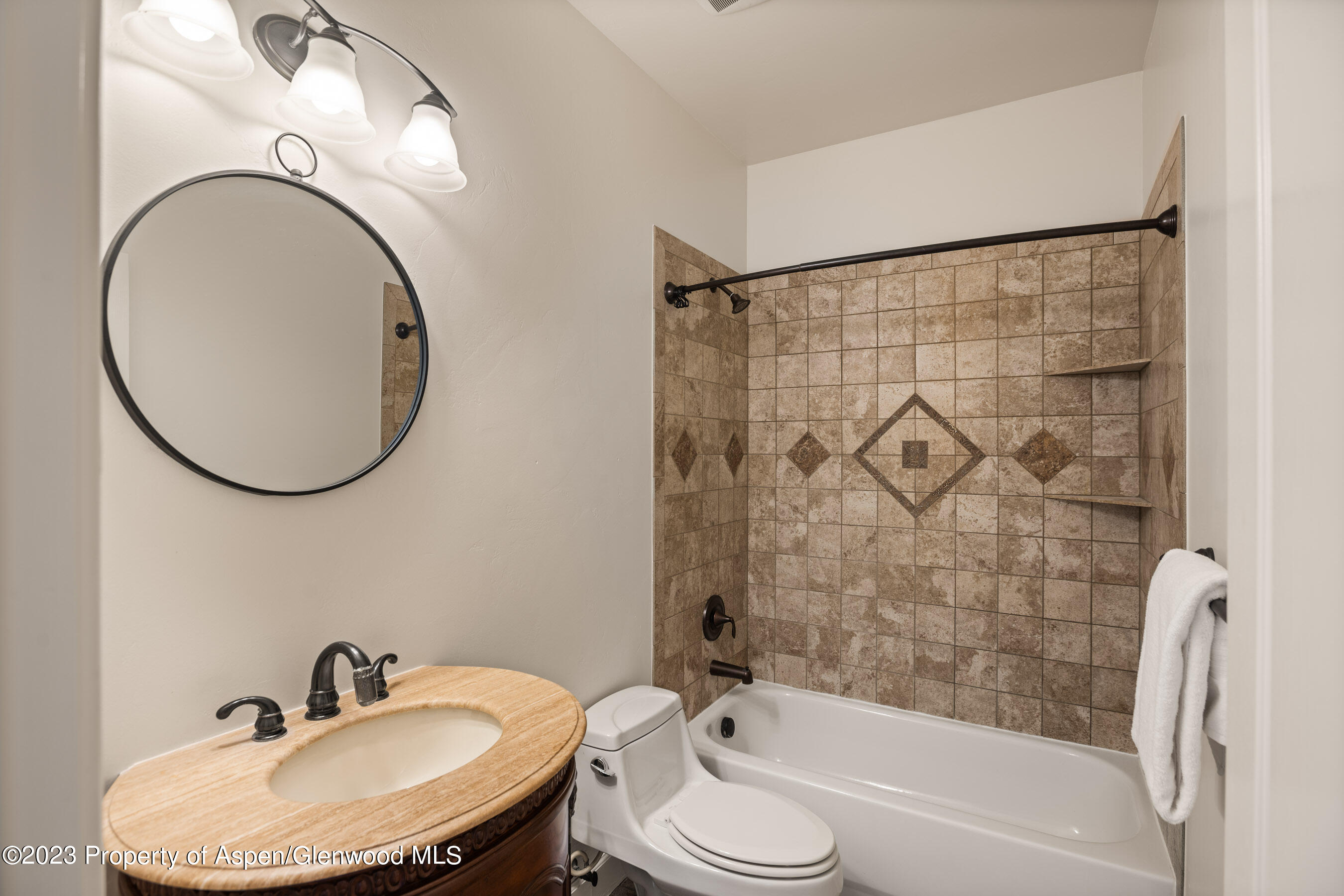 1148 County Road 237 Silt, CO 81652 - Photo 22 of 80 a bathroom with a sink a toilet and a mirror