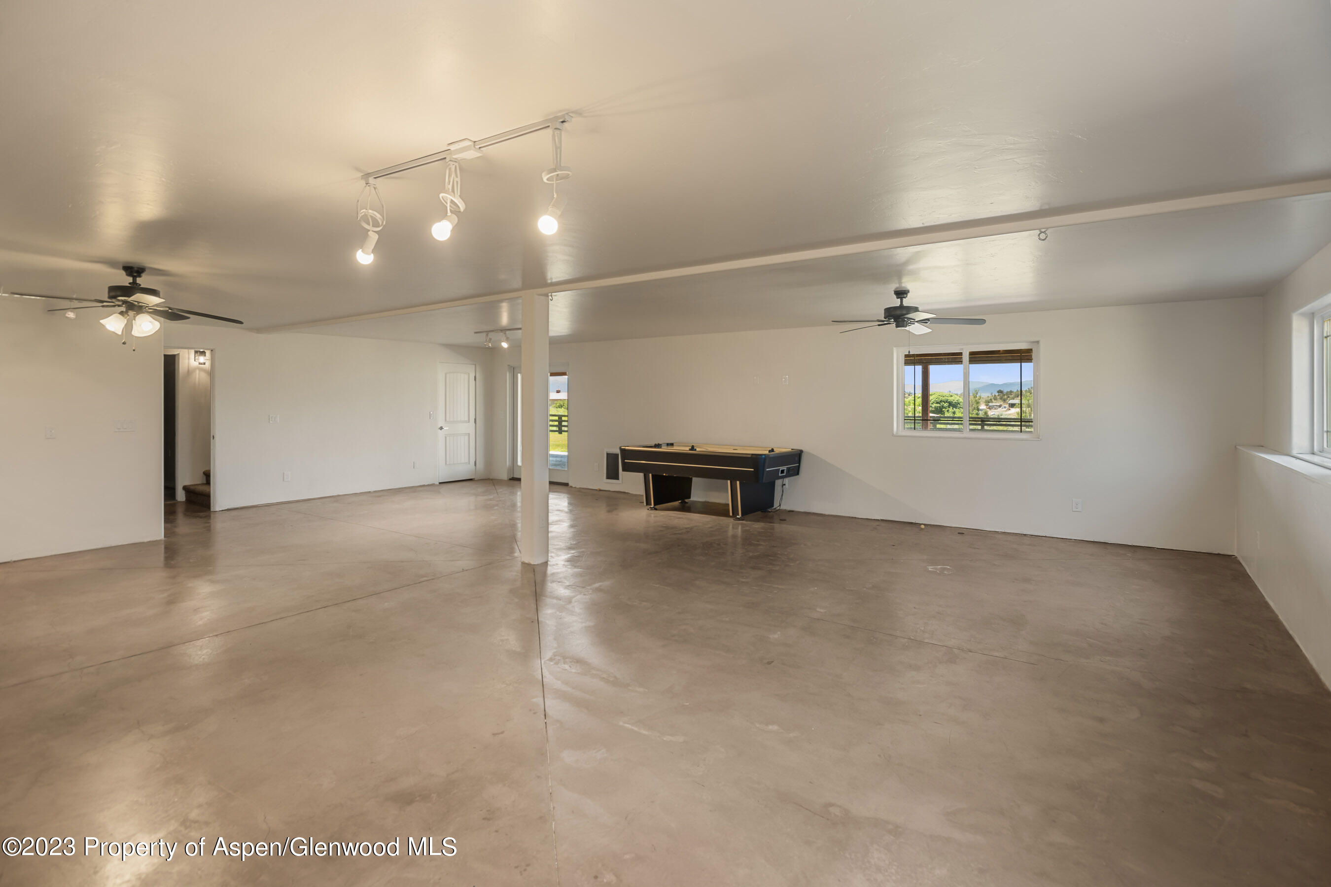 1148 County Road 237 Silt, CO 81652 - Photo 29 of 80 an empty room with a empty space and windows
