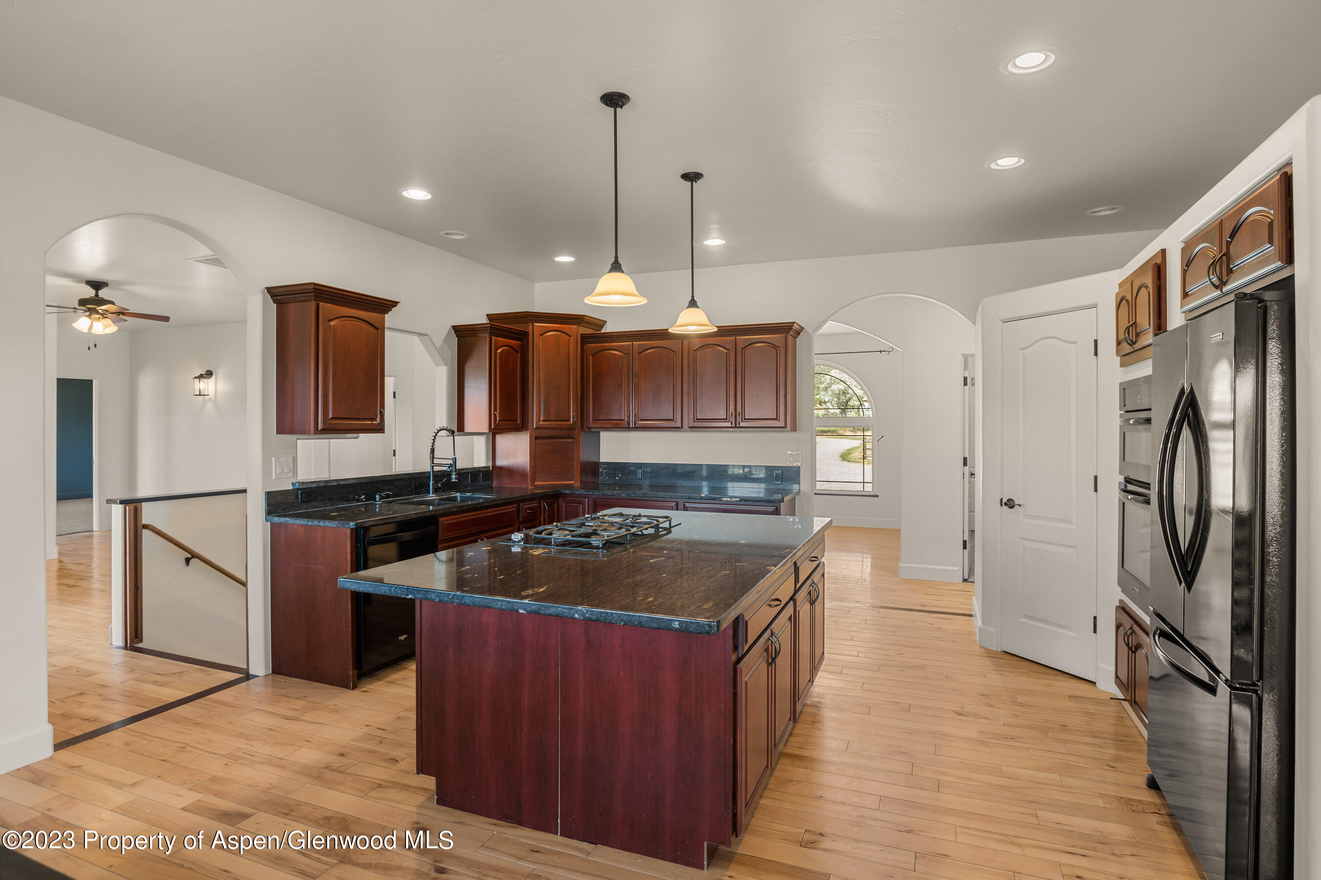 1148 County Road 237 Silt, CO 81652 - Photo 3 of 80 a kitchen with stainless steel appliances granite countertop a sink stove and refrigerator