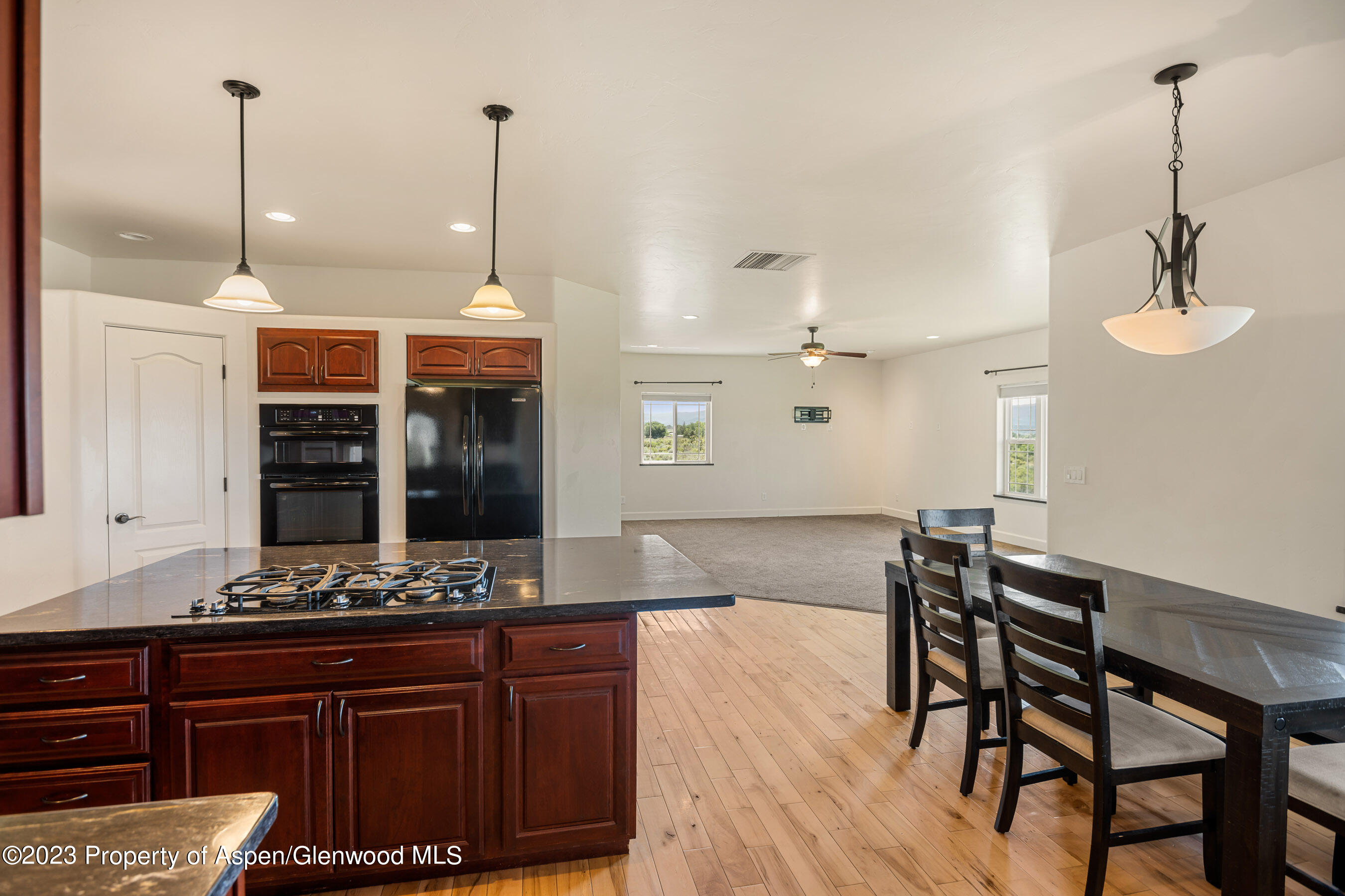 1148 County Road 237 Silt, CO 81652 - Photo 5 of 80 a view of dining room and kitchen with a table chairs