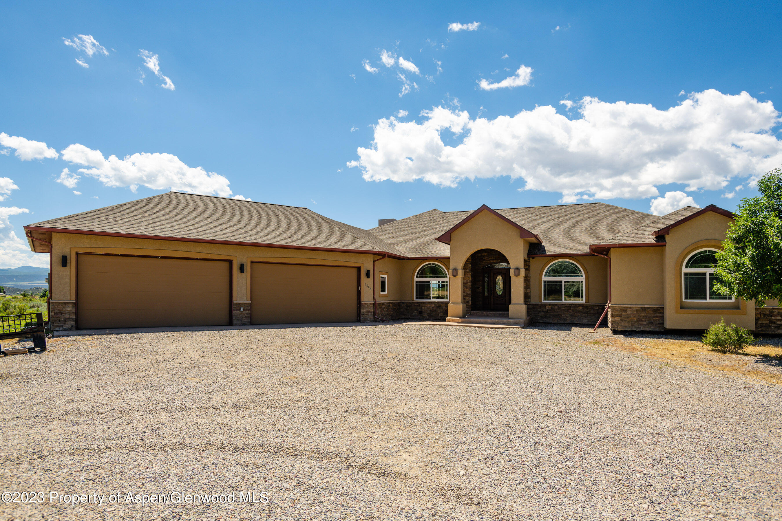 1148 County Road 237 Silt, CO 81652 - Photo 62 of 80 a view of a house with a yard and garage