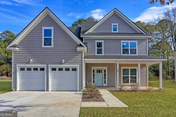 a front view of a house with a yard
