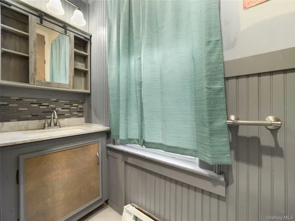 a bathroom with a sink and a mirror