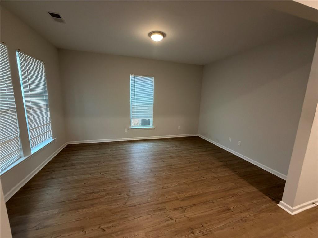 16 Jazz Drive Pooler, GA 31322 - Photo 3 of 17 an empty room with wooden floor and windows