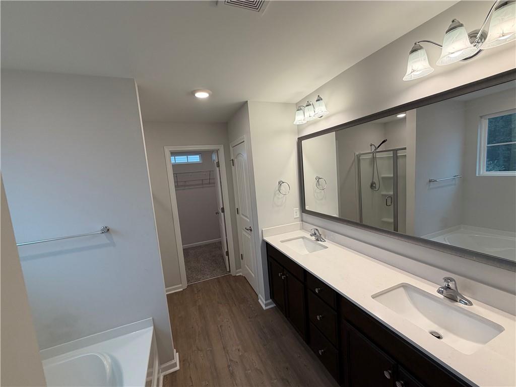 16 Jazz Drive Pooler, GA 31322 - Photo 10 of 17 a spacious bathroom with a double vanity sink a mirror and a shower