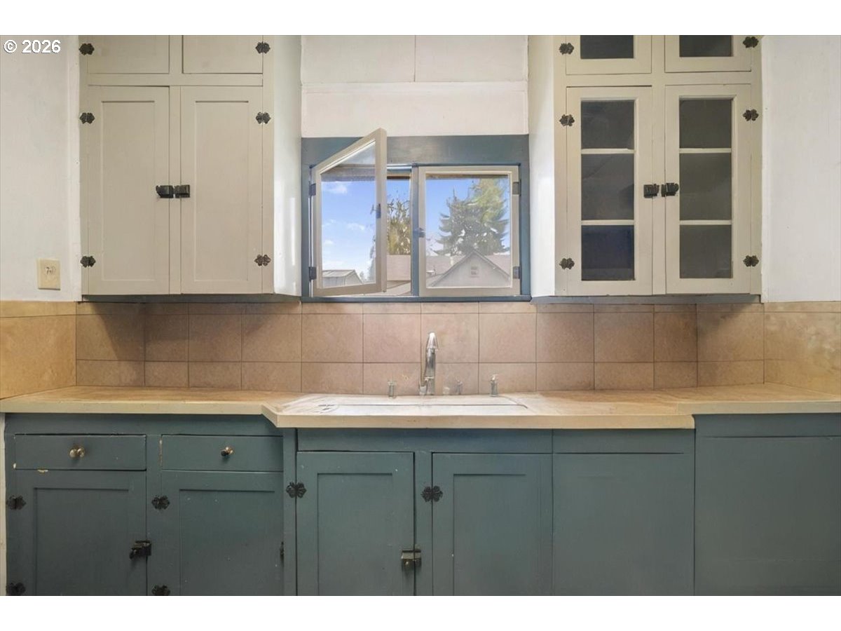 740 South 6th Street Cottage Grove, OR 97424 - Photo 11 of 21 a kitchen with a sink and cabinets