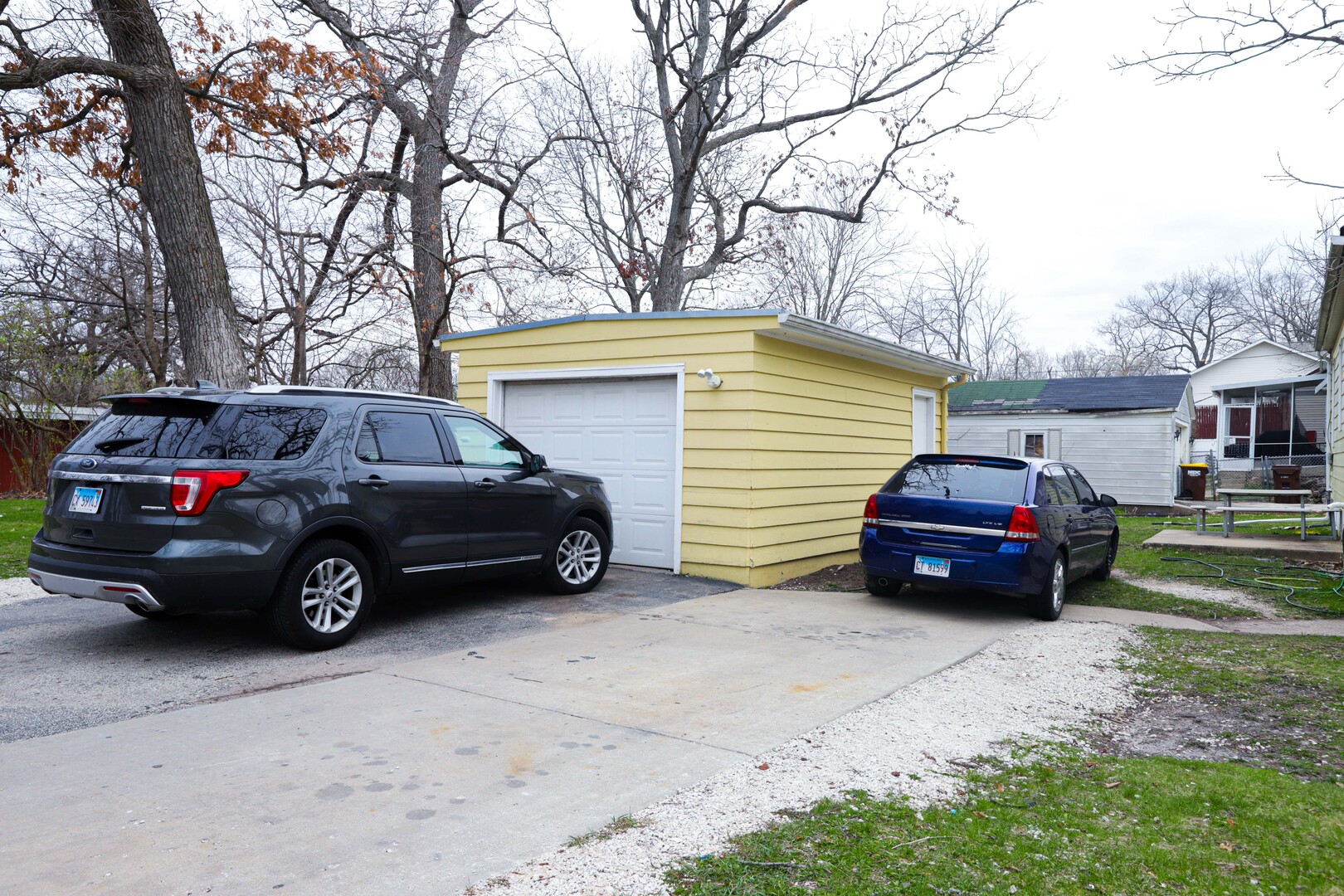 900 Garfield Road Harvard, IL 60033 - Photo 15 of 17 a view of a car that is parked in front of a house