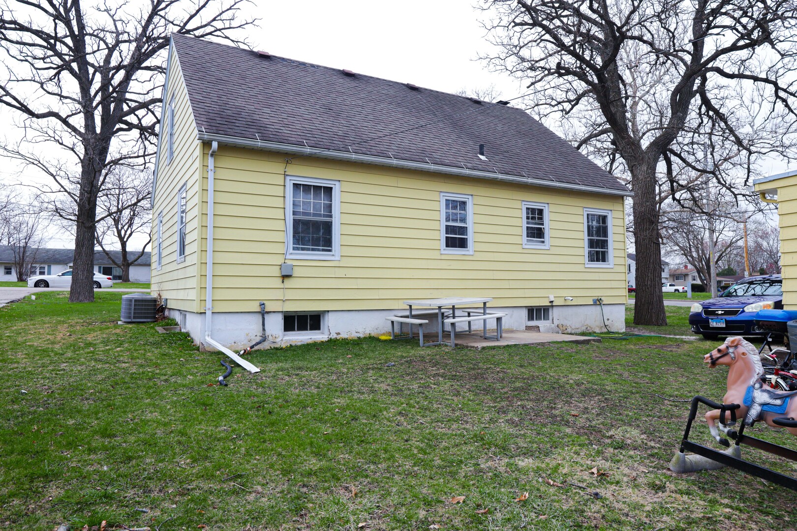 900 Garfield Road Harvard, IL 60033 - Photo 16 of 17 a front view of house with yard and outdoor seating