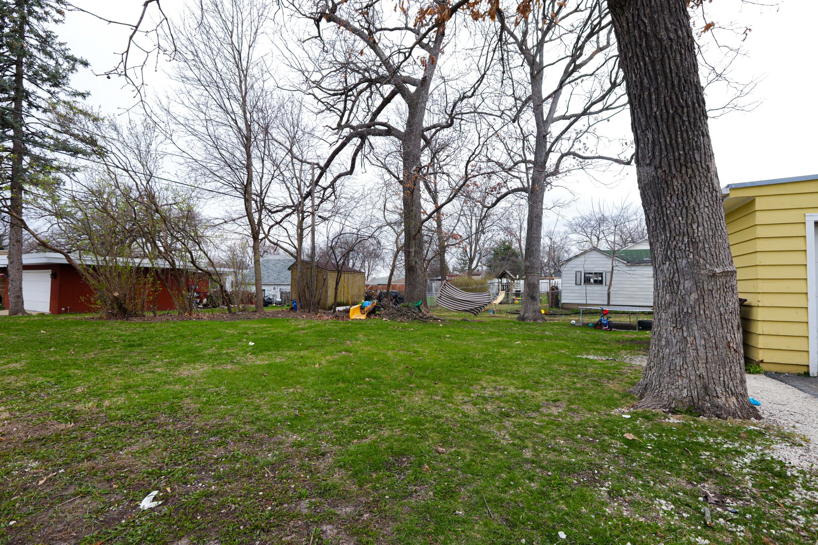 900 Garfield Road Harvard, IL 60033 - Photo 17 of 17 a view of a house with backyard and a tree