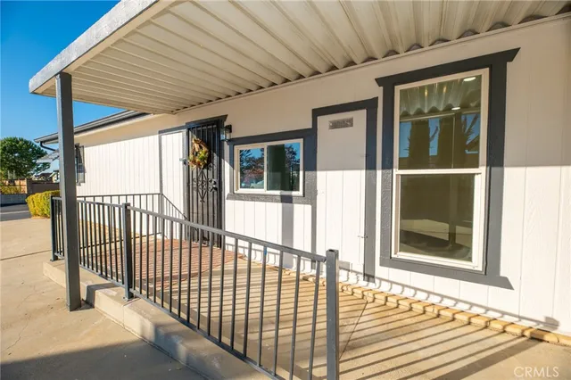 a view of a pathway with a flower garden