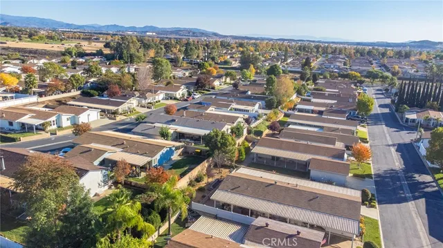 an aerial view of a house with a swimming pool