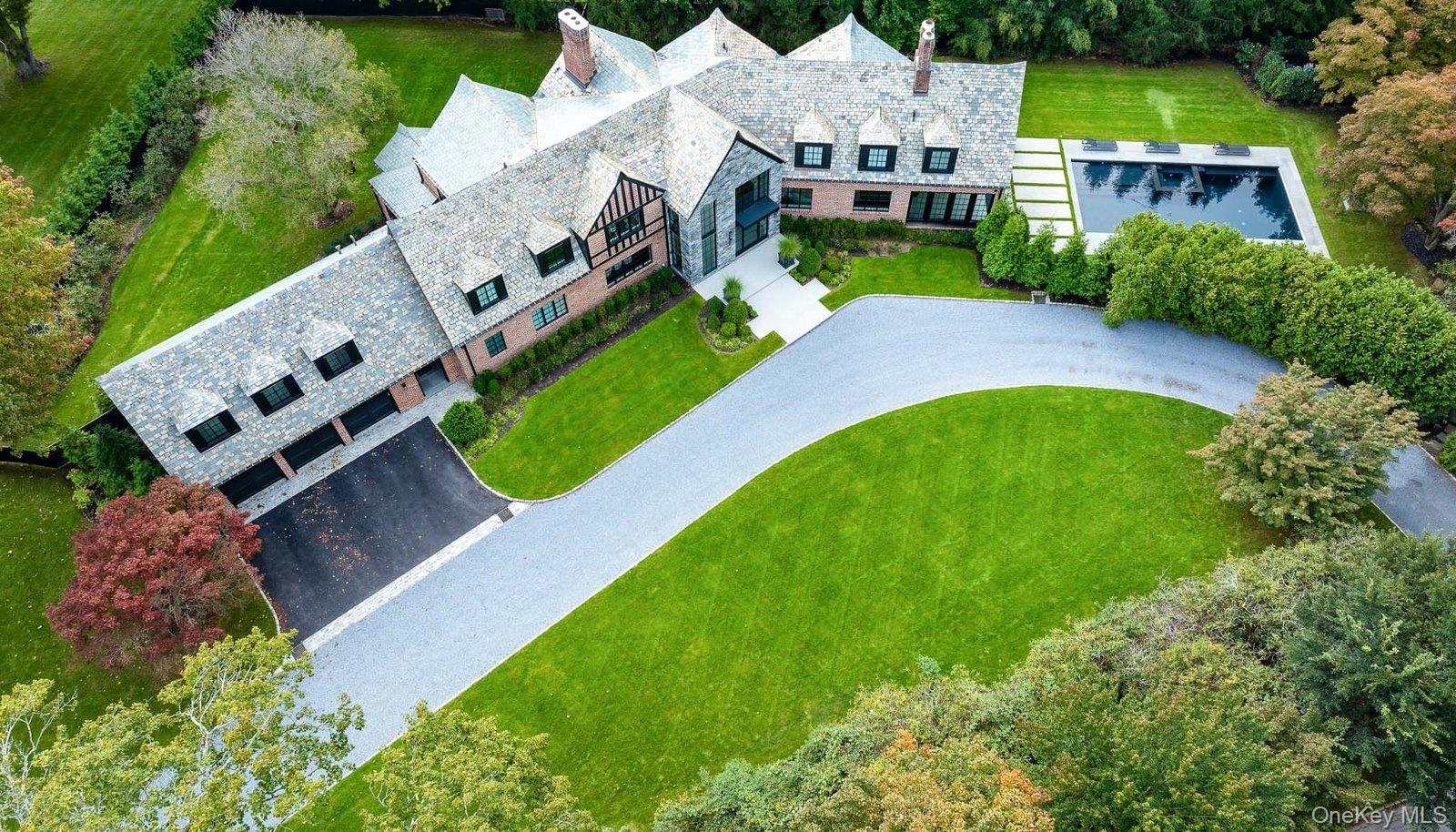 64 Cushman Road Scarsdale, NY 10583 - Photo 3 of 32 an aerial view of a house