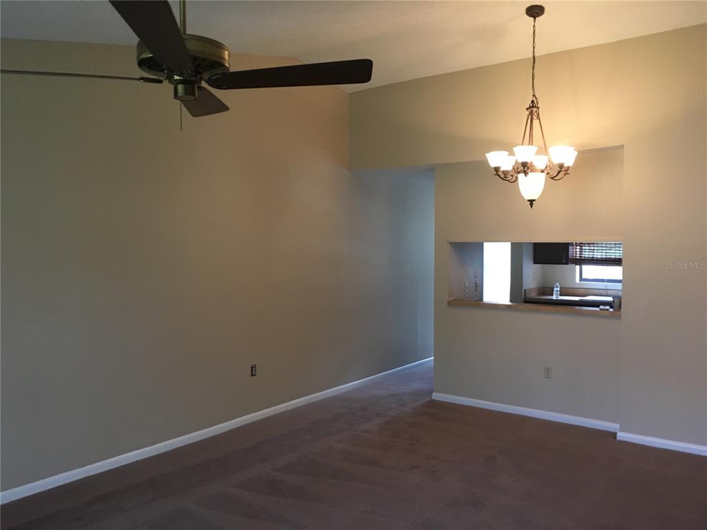 4709 Capri Place, Unit 189 Orlando, FL 32811 - Photo 6 of 9 a view of a chandelier in a room