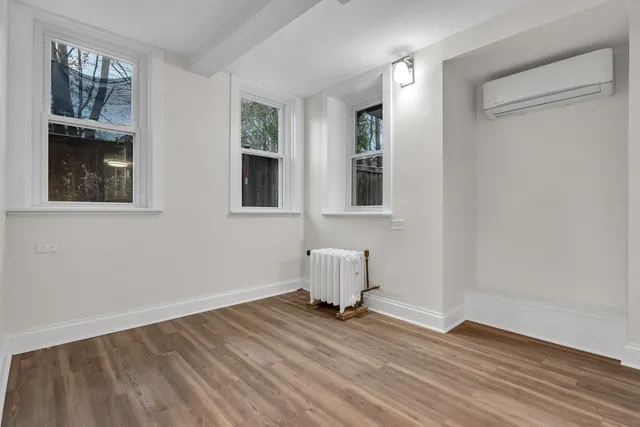 a room view with wooden floor and cabinet